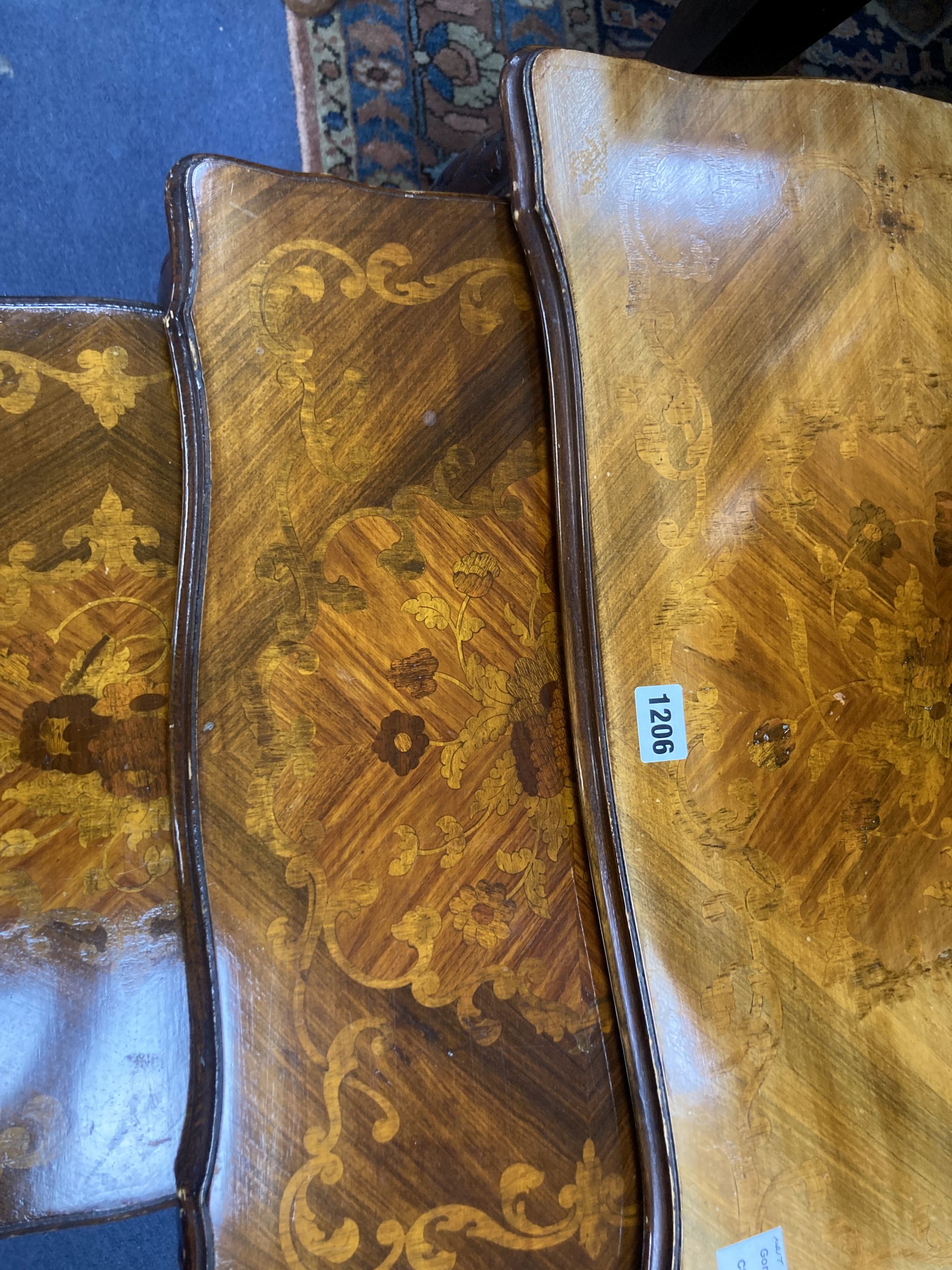 A nest of three marquetry inlaid walnut tea tables, width 59cm, depth 36cm, height 49cm
